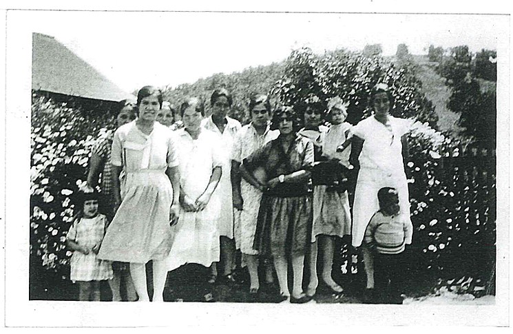 A group of women who took the ranch's Americanization classes. Morales is the cute toddler at the bottom left.
