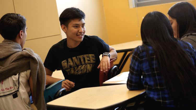 Senior Noe Martinon, 18, center, discusses a project with fellow students in an AP Psychology. Marti