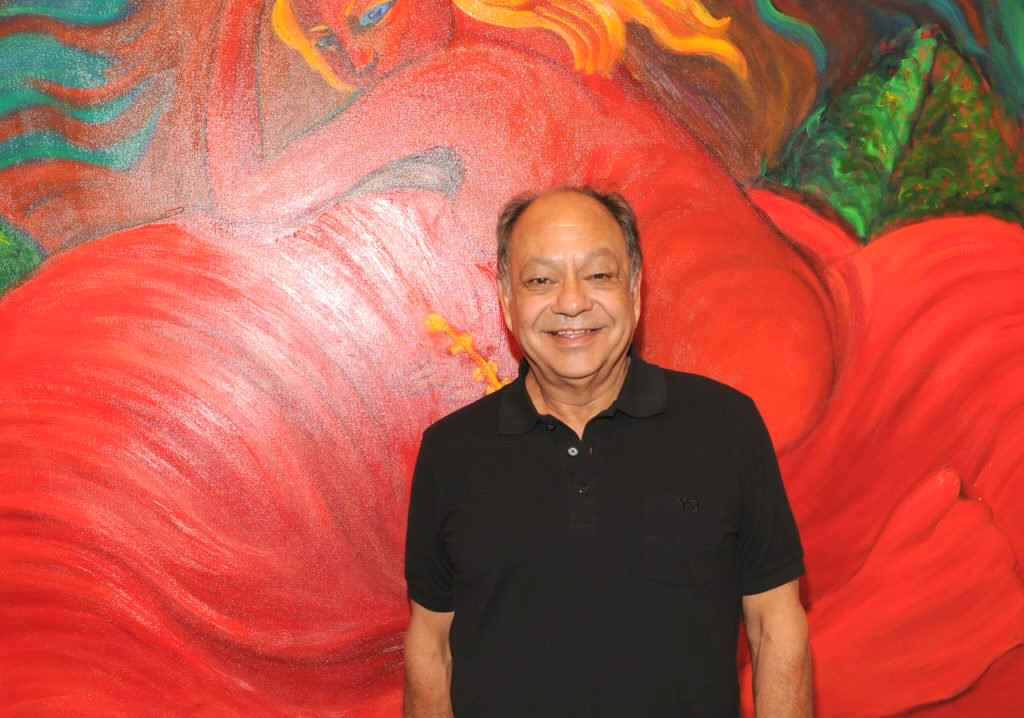 Cheech Marin with a painting by Margaret Garcia in 2012. Patrick McMullan.