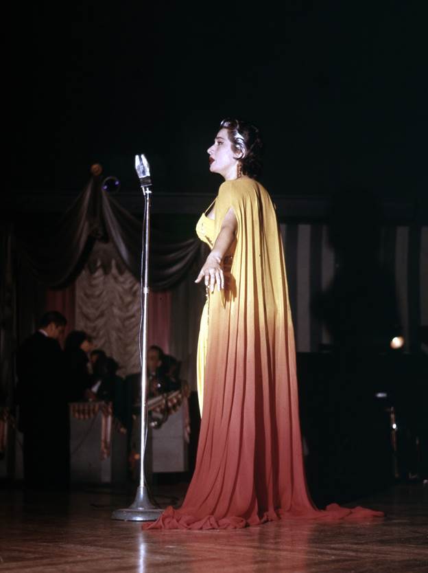 Sumac was known for her glamorous, queenly outfits  seen here in 1957.