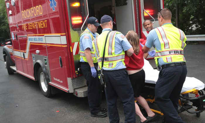 Firefighters help an overdose victim in Rockford, Illinois, on July 14, 2017. (Scott Olson/Getty Images)